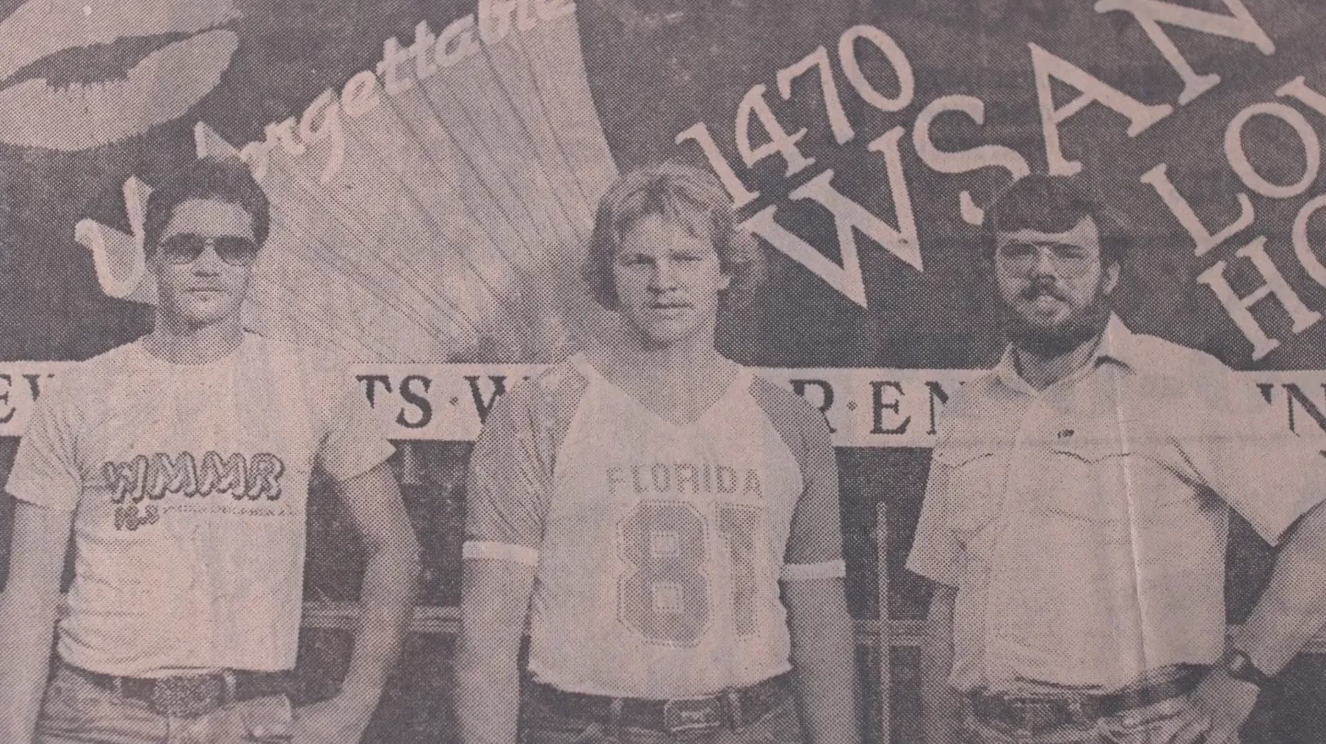 The three contestants in front of the WSAN billboard above Route 22, 1982