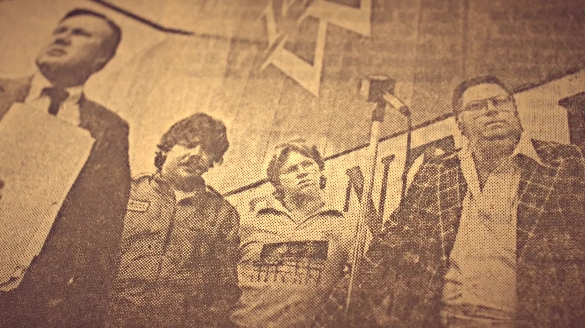 Newspaper photo of the three contestants on the platform